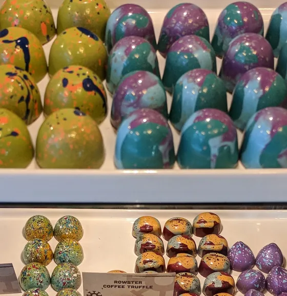 Green speckled Thai Basil Black Pepper bonbons.